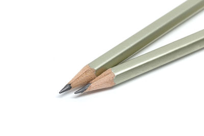 Close-up of colored pencils against white background