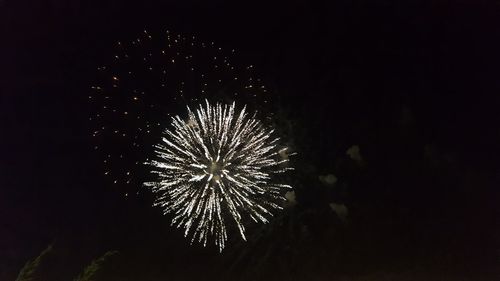 Firework display at night