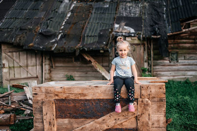 Portrait of young woman standing in barn