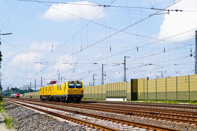 Train on tracks against sky