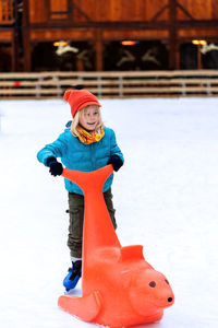 Full length of boy playing with toy outdoors