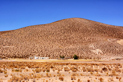 View of desert against clear sky