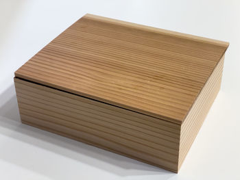 High angle view of books on table against white background