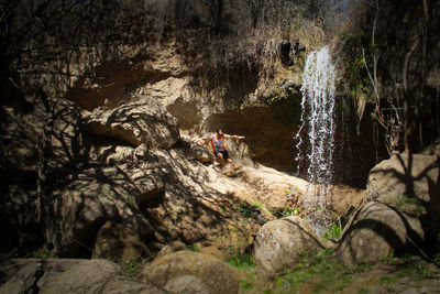 Scenic view of waterfall in forest