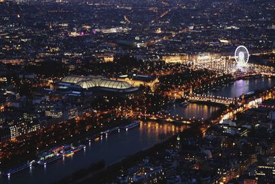 Aerial view of city lit up at night