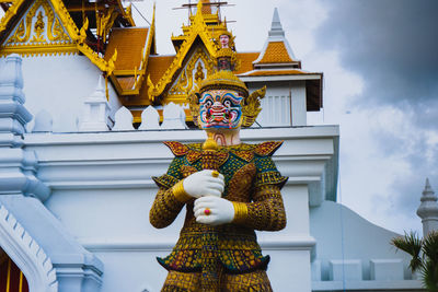 Low angle view of statue against building