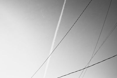 Low angle view of vapor trail against sky