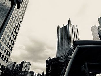 Low angle view of modern buildings against sky in city