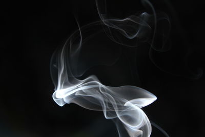 Close-up of white smoke against black background