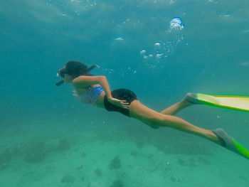 People swimming in sea