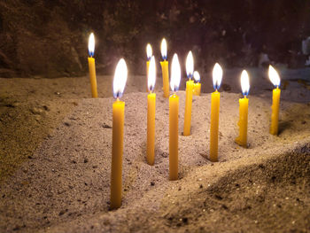 Close-up of burning candles
