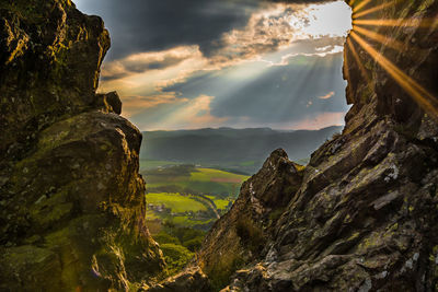 Rock formations against sky during sunset