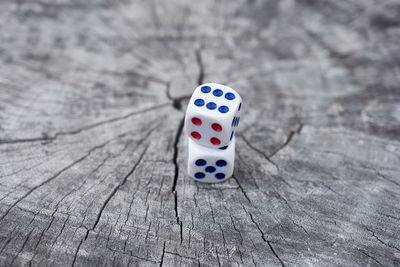 High angle view of dice on wood