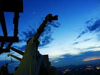 Low angle view of silhouette statue against sky