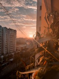 Cityscape against sky during sunset