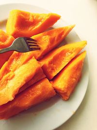 Close-up of orange slice in plate