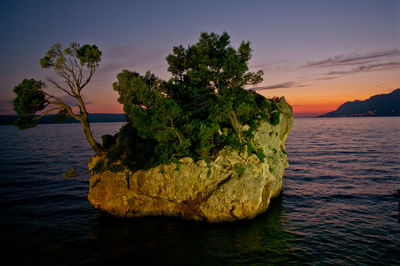 Scenic view of sea against sky at sunset