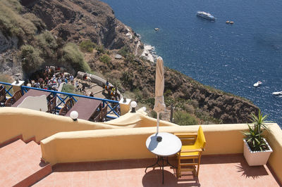 Sea view terrace fira, santorini with donkeys carrying tourists to the port. greece
