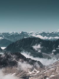 Scenic view of snowcapped mountains against clear sky