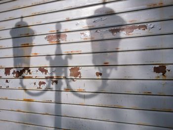 Close-up of shadows on wooden wall