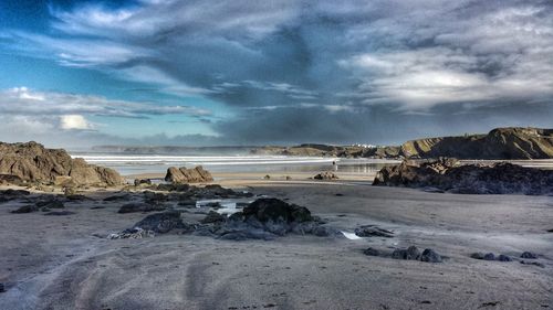 Scenic view of sea against cloudy sky