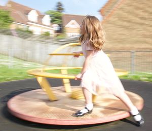 Rear view of woman with girl in background