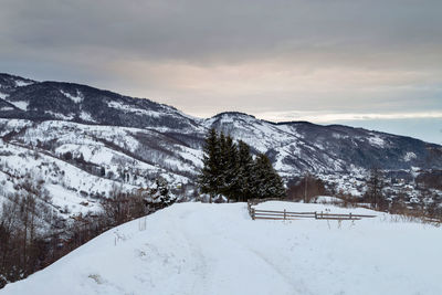 Scenic view of mountains against sky during winter