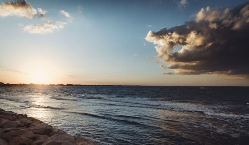 Scenic view of sea against sky during sunset