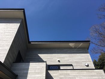 Low angle view of built structure against blue sky