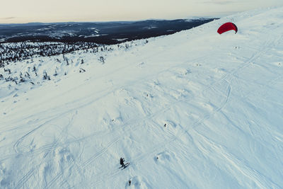 Aerial view of people on snowcapped mountain