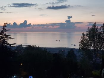 High angle view of silhouette trees against sky at sunset