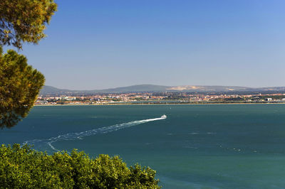 Scenic view of sea against clear blue sky