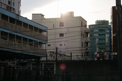 Buildings in city against sky