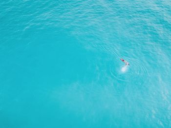 High angle view of man swimming in sea