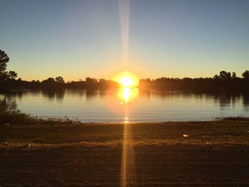 Scenic view of sunset over lake