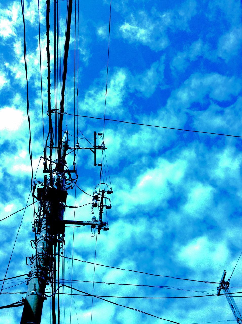 power line, electricity pylon, electricity, power supply, low angle view, cable, connection, fuel and power generation, sky, technology, cloud - sky, cloudy, cloud, complexity, blue, power cable, no people, day, outdoors, electricity tower