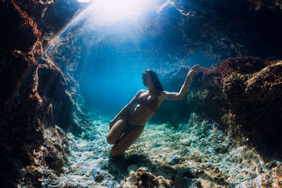 Woman swimming in sea