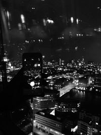 Aerial view of illuminated cityscape at night