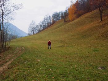 Full length of woman standing on grassy field