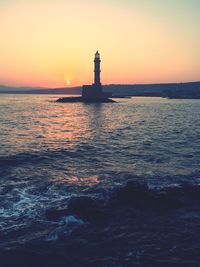 Venetian lighthouse at harbor during sunset