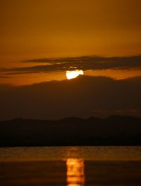 Scenic view of sea against romantic sky at sunset