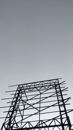 Low angle view of metallic structure against sky