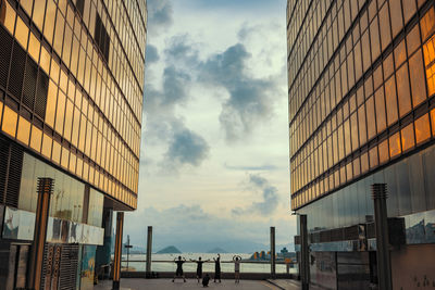 Modern buildings against sky in city