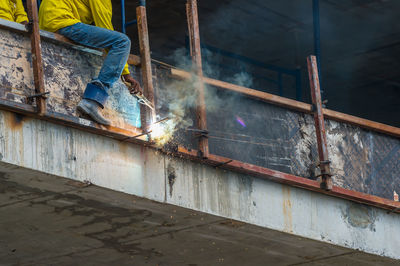 Low section of man working at construction site