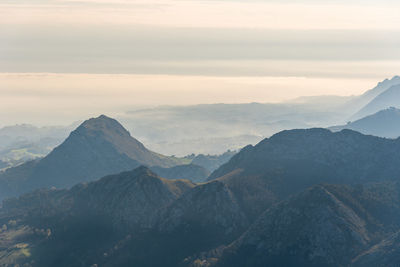 Scenic view of mountains against sky during sunset