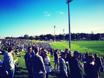 People on grassy field