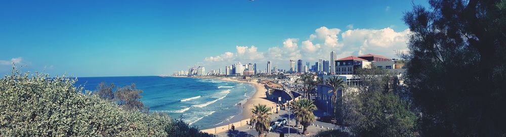 Panoramic view of beach against blue sky