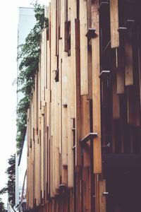 Low angle view of street light by building