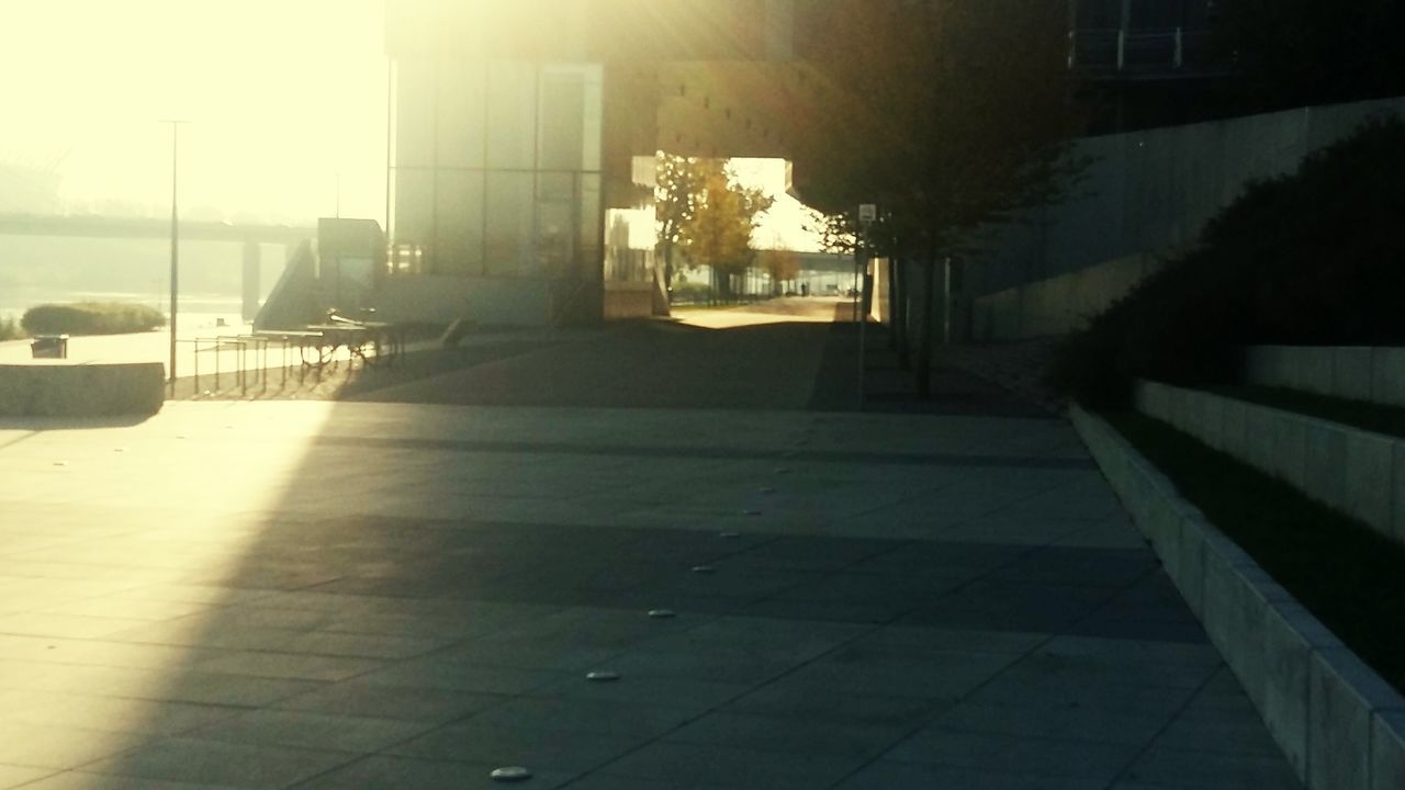 FOOTPATH AMIDST BUILDINGS IN CITY