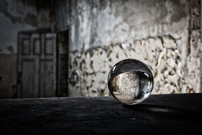 Close-up of abandoned glass wall